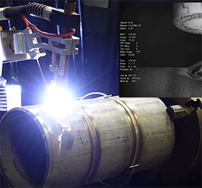 A robotic laser welding machine works on a cylindrical metal pipe. Bright light emanates from the welding process. An inset shows technical data such as speed and power about the welding operation on a screen.